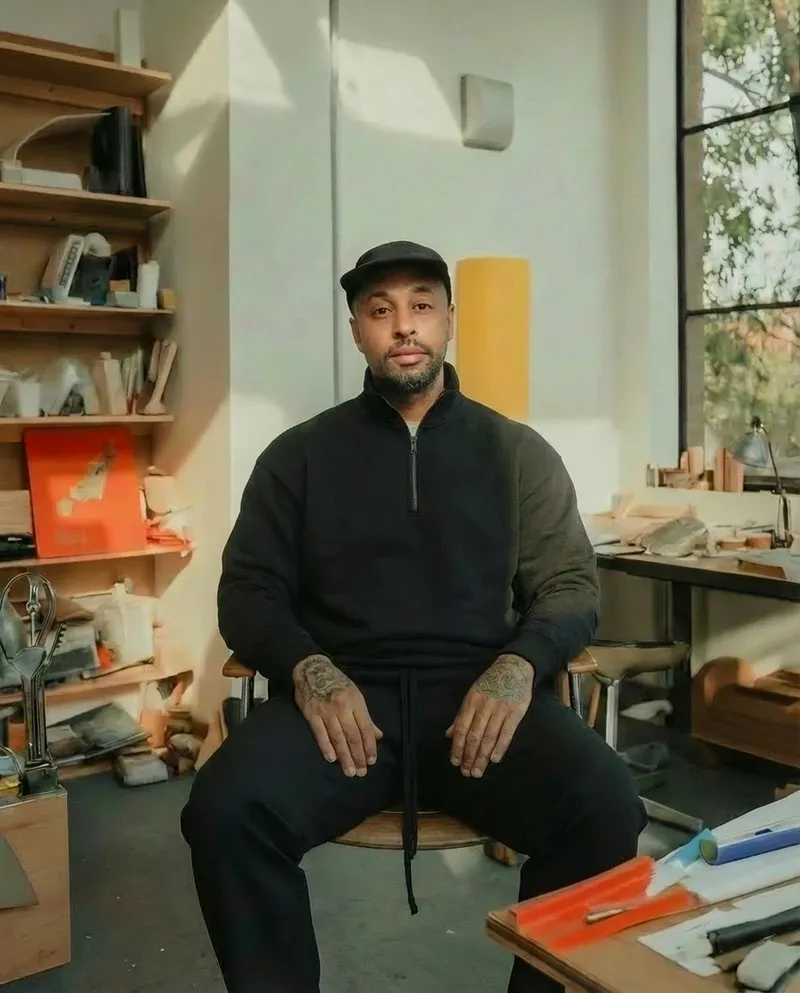 Carl Brunson, seated in a design studio